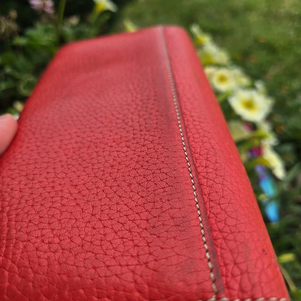 kate spade bifold pebble leather wallet. In red. Flaws